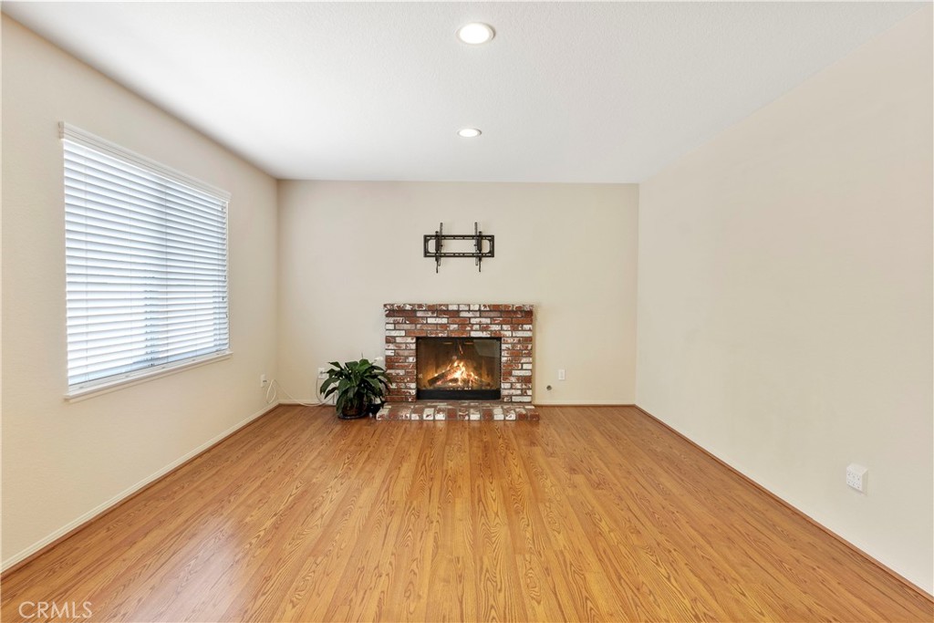 6879 Mission Grove Parkway North Riverside, CA 92506 - Photo 15 of 53 a view of an empty room with wooden floor and a window