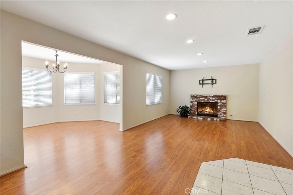 6879 Mission Grove Parkway North Riverside, CA 92506 - Photo 20 of 53 a view of an empty room with window and wooden floor