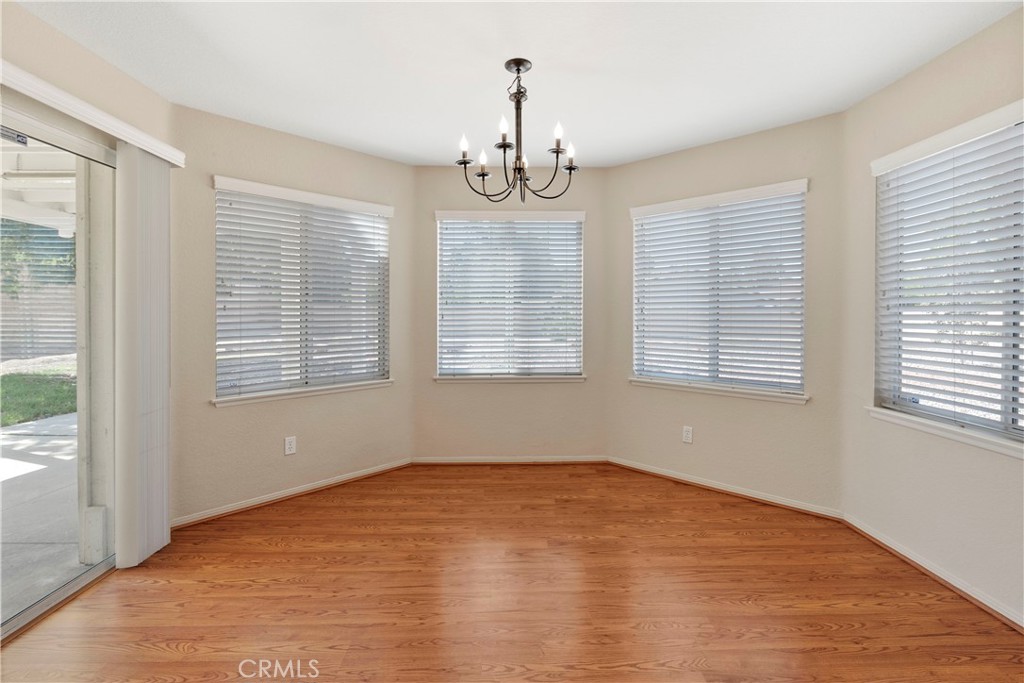 6879 Mission Grove Parkway North Riverside, CA 92506 - Photo 22 of 53 a view of empty room with wooden floor and fan