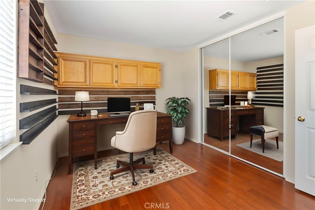 6879 Mission Grove Parkway North Riverside, CA 92506 - Photo 32 of 53 a living room with furniture a rug and a window