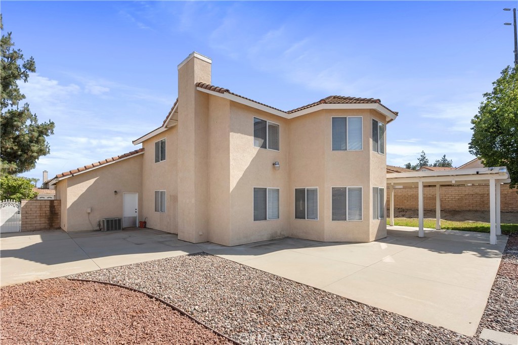 6879 Mission Grove Parkway North Riverside, CA 92506 - Photo 42 of 53 a front view of a house with a yard