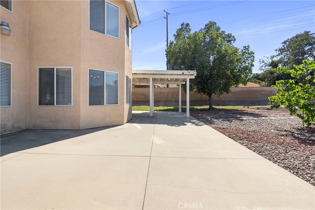 6879 Mission Grove Parkway North Riverside, CA 92506 - Photo 43 of 53 a view of house with backyard and glass windows