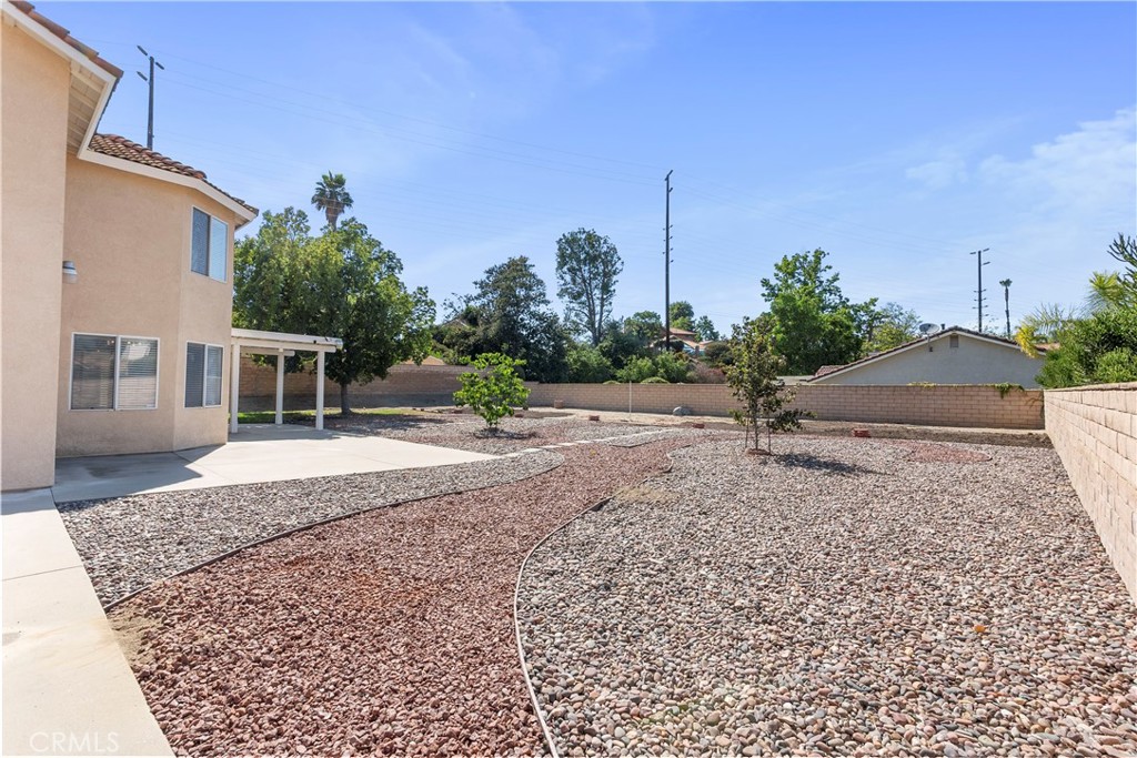 6879 Mission Grove Parkway North Riverside, CA 92506 - Photo 45 of 53 front view of a house with a yard