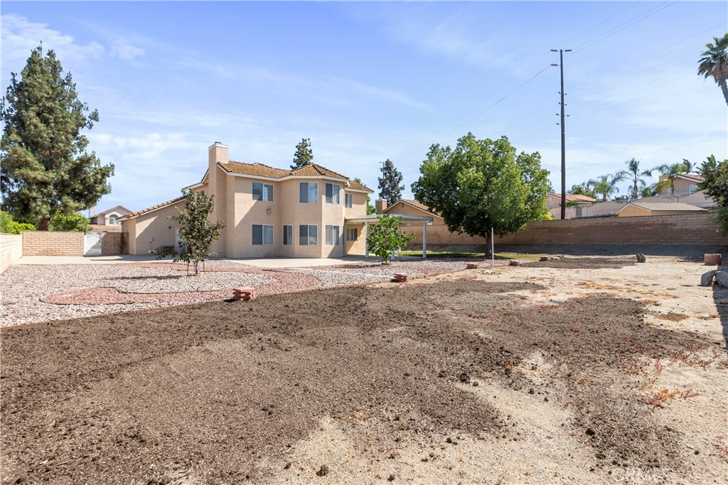 6879 Mission Grove Parkway North Riverside, CA 92506 - Photo 47 of 53 a view of a house with a yard