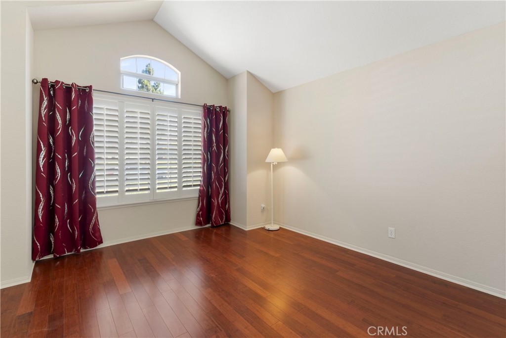 6879 Mission Grove Parkway North Riverside, CA 92506 - Photo 6 of 53 a view of an empty room with wooden floor and a window