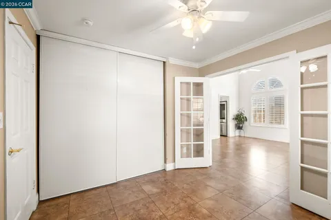 a view of empty room with a flat screen tv and a fireplace