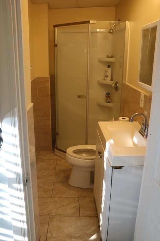 90 Pine Street Swampscott, MA 01907 - Photo 11 of 22 a bathroom with a sink a toilet and shower