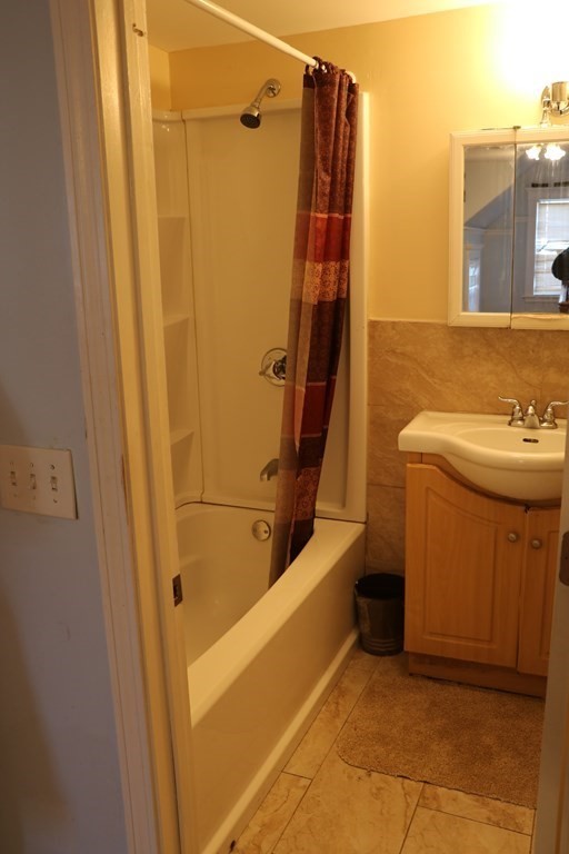 90 Pine Street Swampscott, MA 01907 - Photo 15 of 22 a bathroom with a sink a toilet and shower