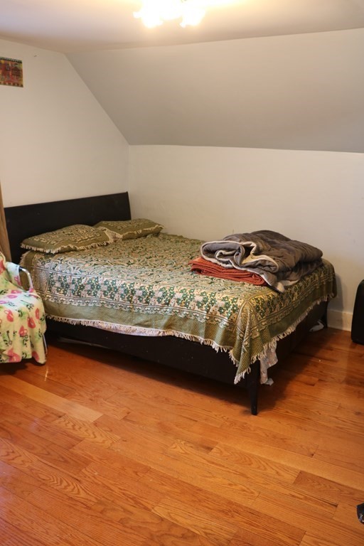 90 Pine Street Swampscott, MA 01907 - Photo 16 of 22 a bedroom with a bed and a flat screen tv