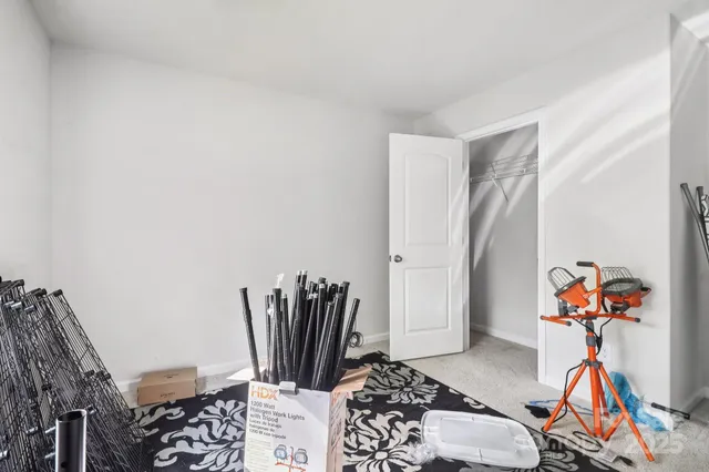 a view of a livingroom with furniture and a flat screen tv