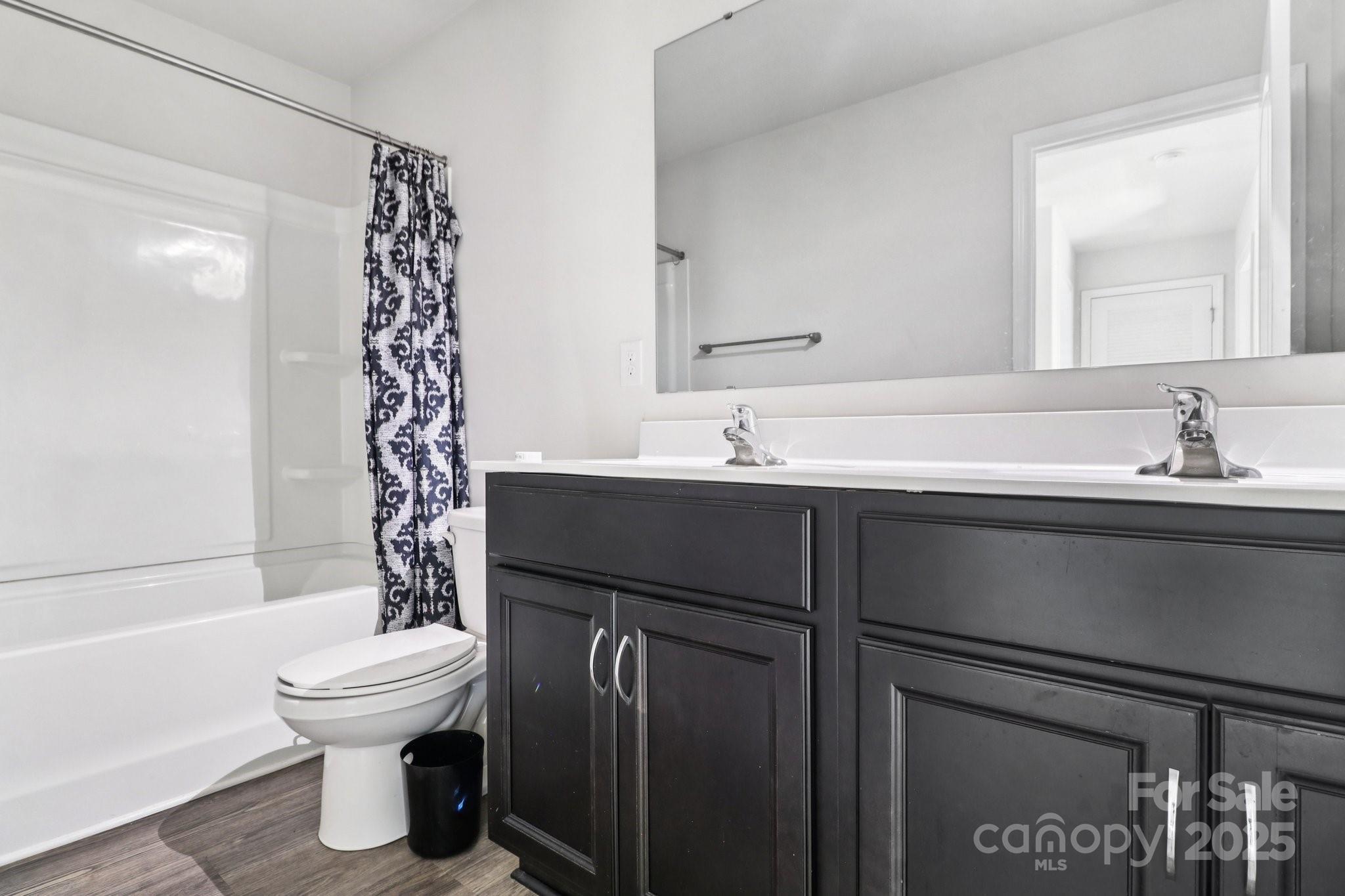 100 South Gregory Street Lancaster, SC 29720 - Photo 20 of 27 a bathroom with a sink toilet and shower