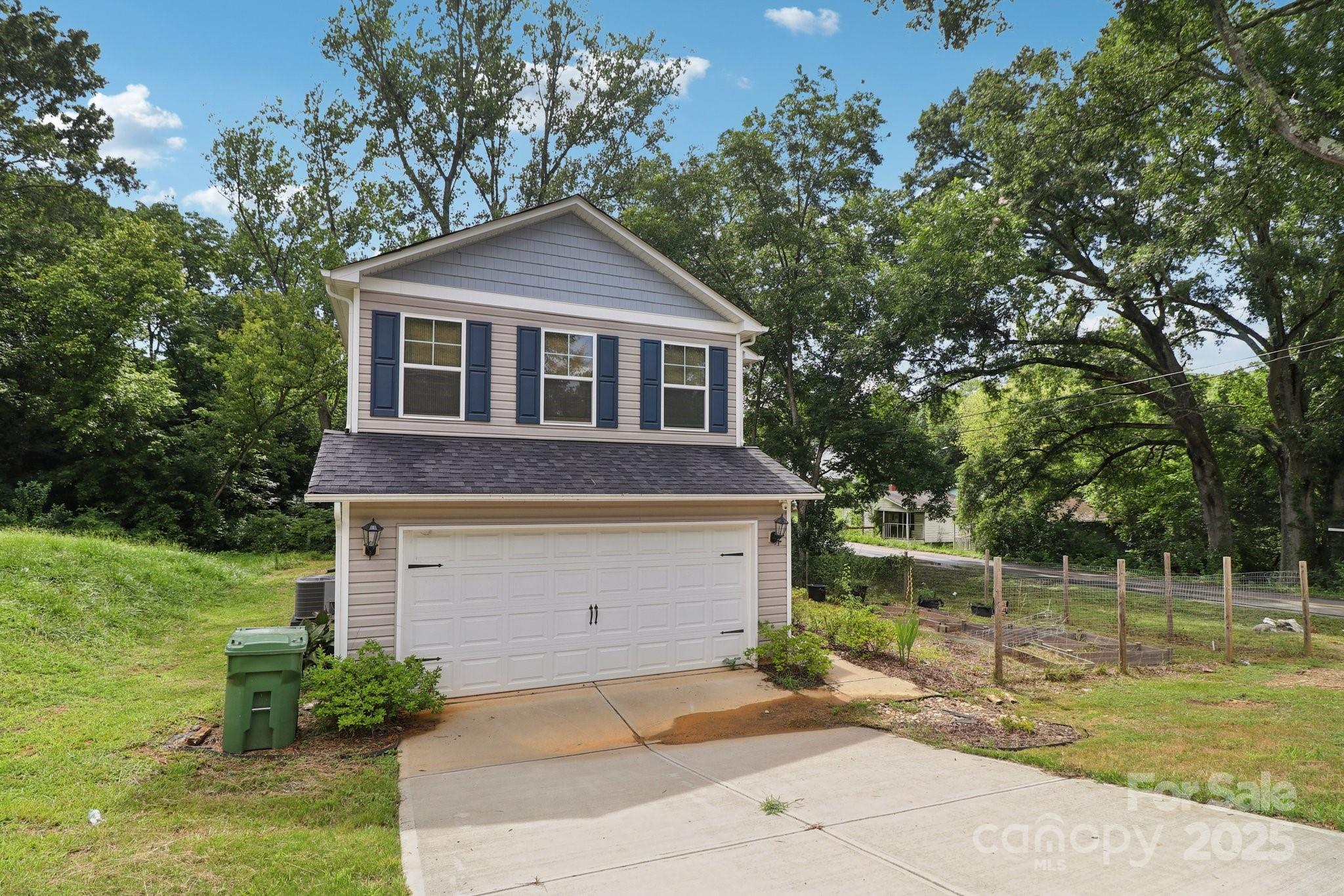 100 South Gregory Street Lancaster, SC 29720 - Photo 2 of 27 a front view of a house with a yard
