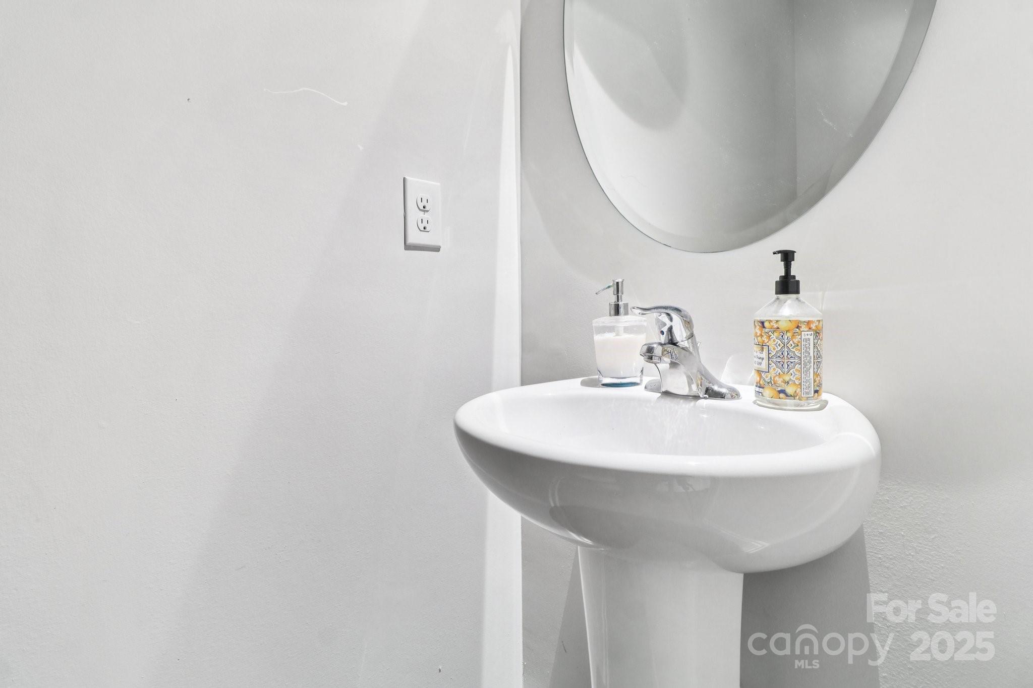 100 South Gregory Street Lancaster, SC 29720 - Photo 21 of 27 a sink with a mirror