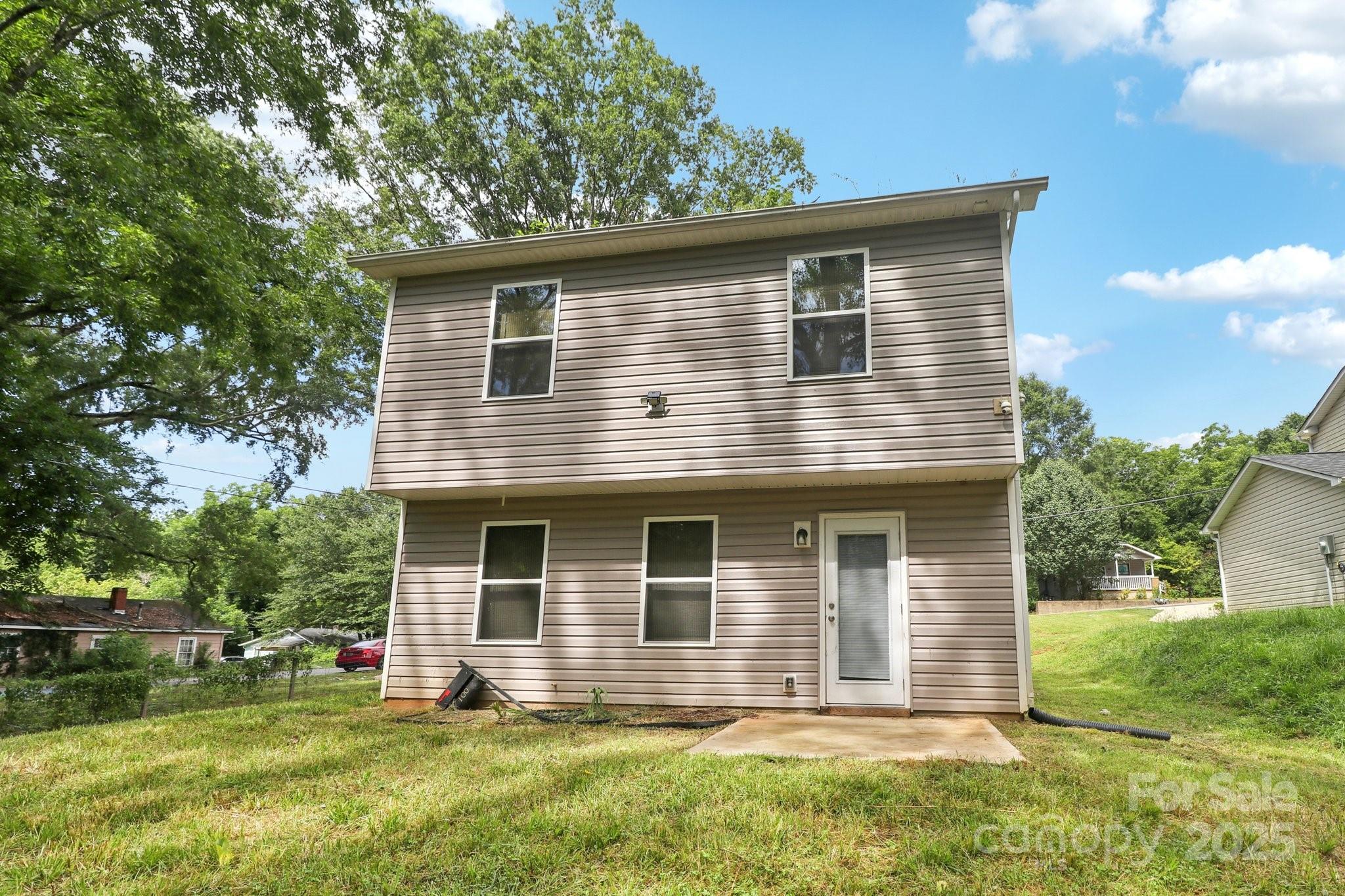 100 South Gregory Street Lancaster, SC 29720 - Photo 24 of 27 a front view of a house with a yard