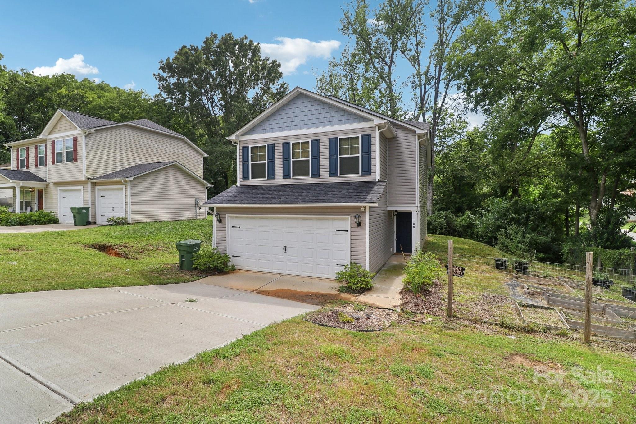 100 South Gregory Street Lancaster, SC 29720 - Photo 3 of 27 a front view of a house with a yard and garage