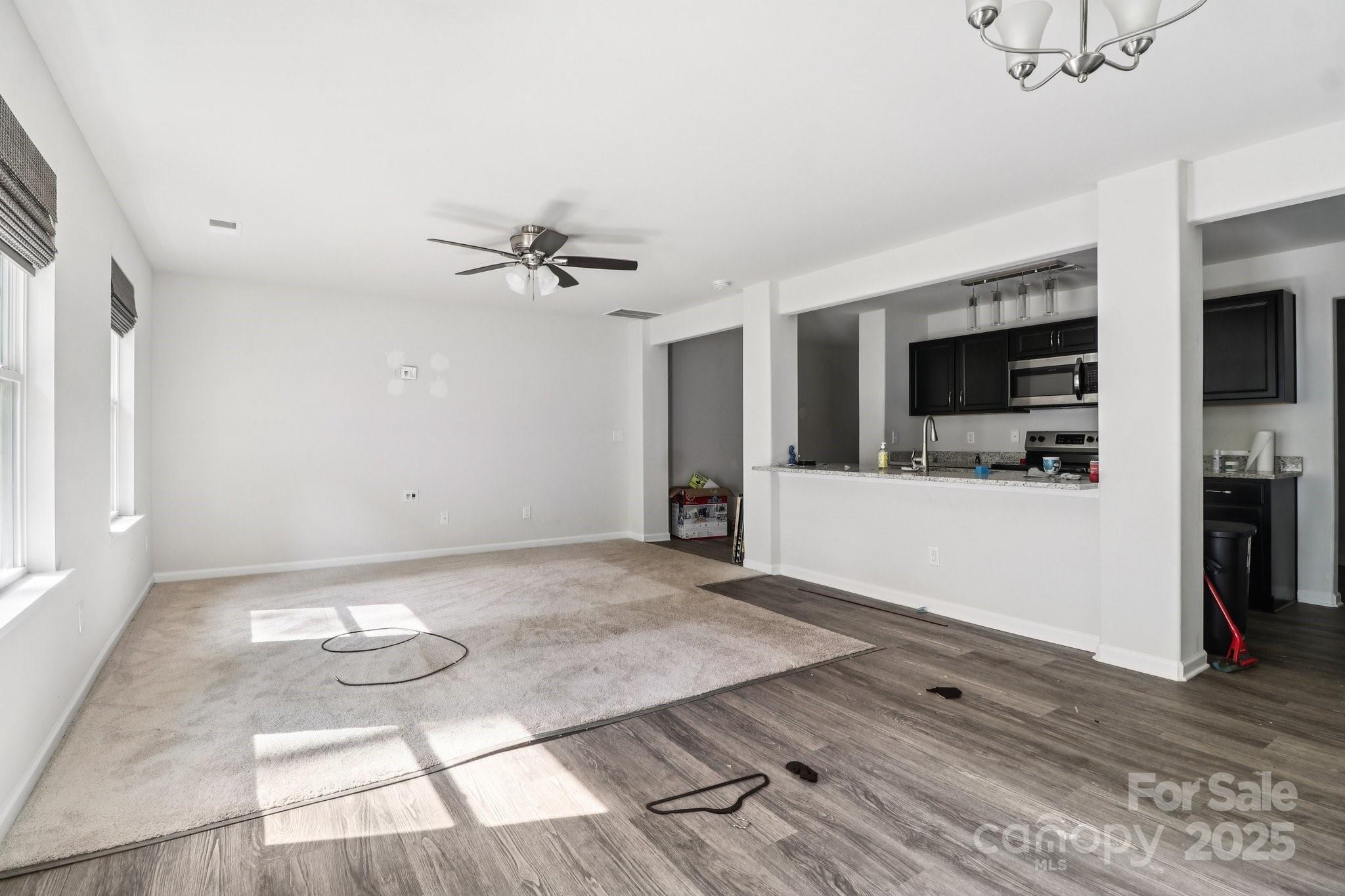 100 South Gregory Street Lancaster, SC 29720 - Photo 5 of 27 a view of a livingroom with furniture and a kitchen