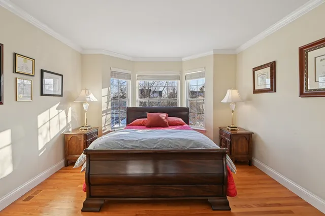 a bed room with a bed and a window