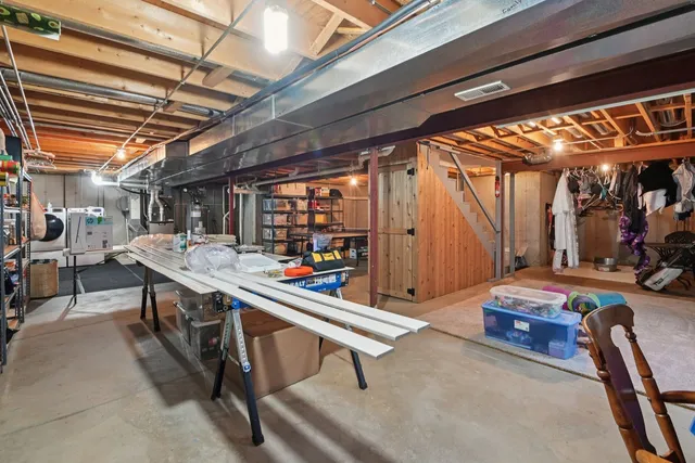 a room with lots of wooden furniture and a shower