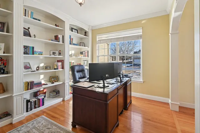 a workspace with furniture and a book shelf