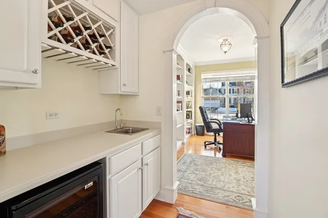 a view of a kitchen with a sink and cabinets