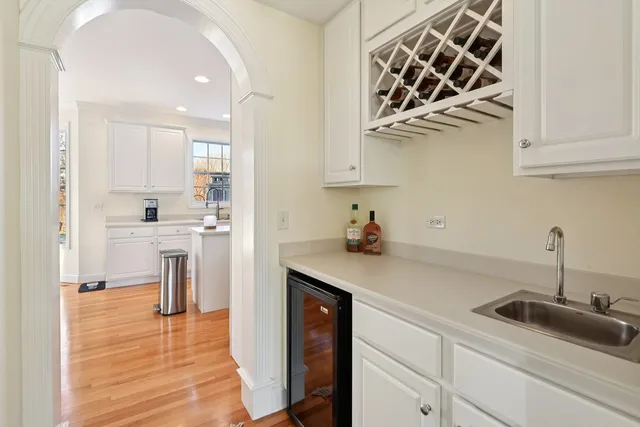 a kitchen with a sink cabinets and appliances