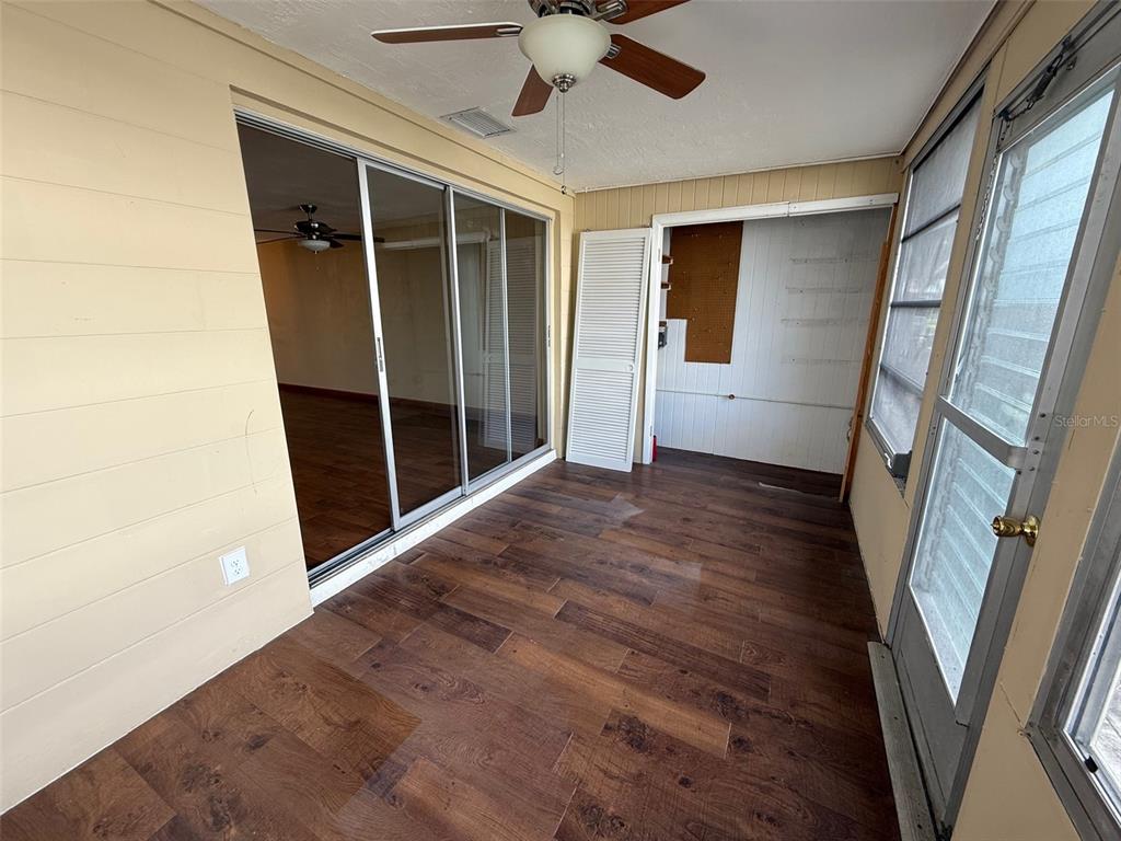 4233 Tamargo Drive, Unit 4233 New Port Richey, FL 34652 - Photo 12 of 13 a view of entryway with wooden floor and fan