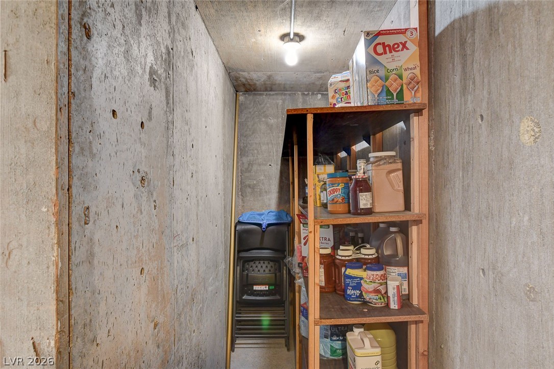4362 Thistle Street Logandale, NV 89021 - Photo 66 of 99 A well-organized basement storage area offers practical shelving for household essentials.