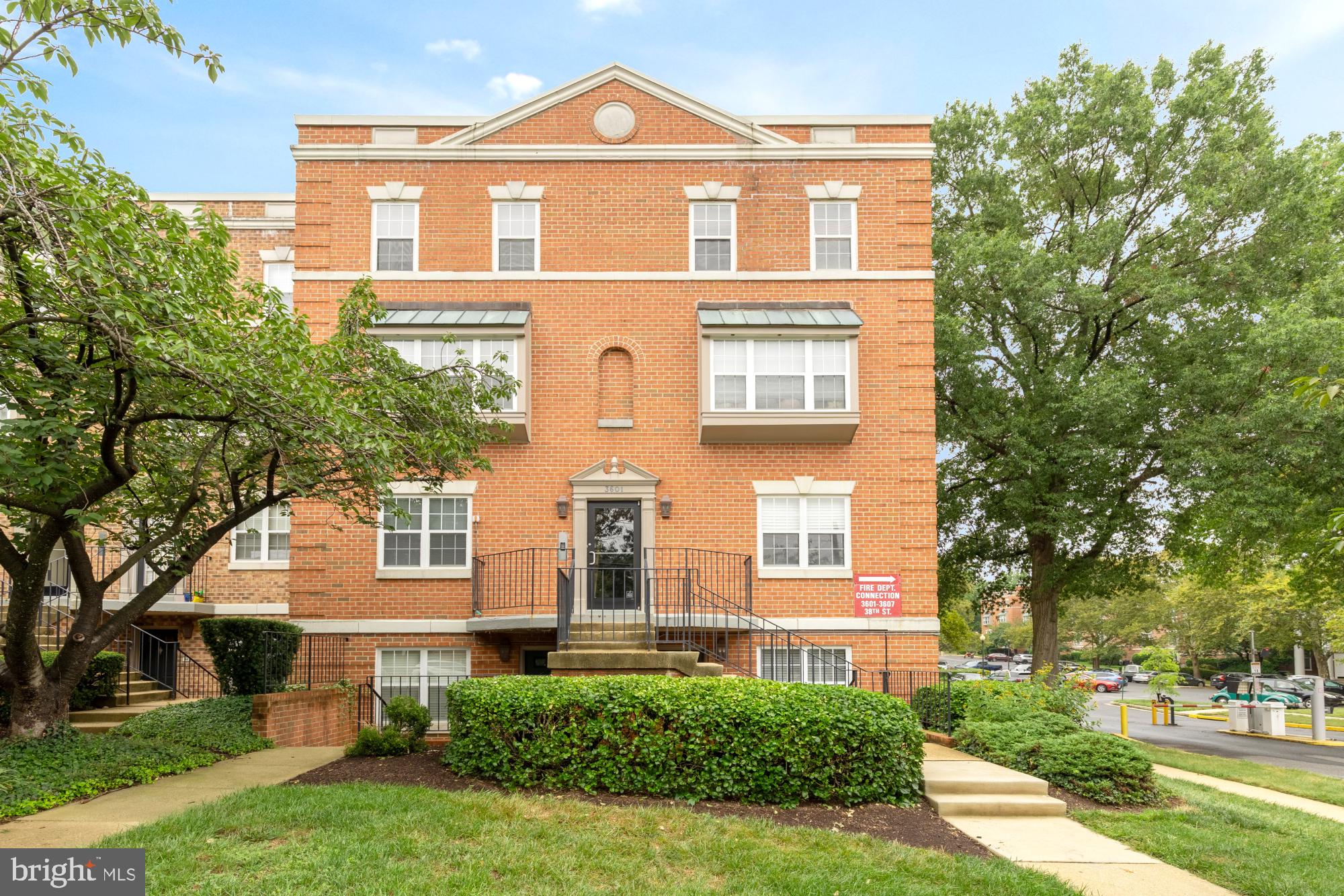 3601 38th Street Northwest, Unit 303 Washington, DC 20016 - Photo 14 of 19 front view of a house with a yard