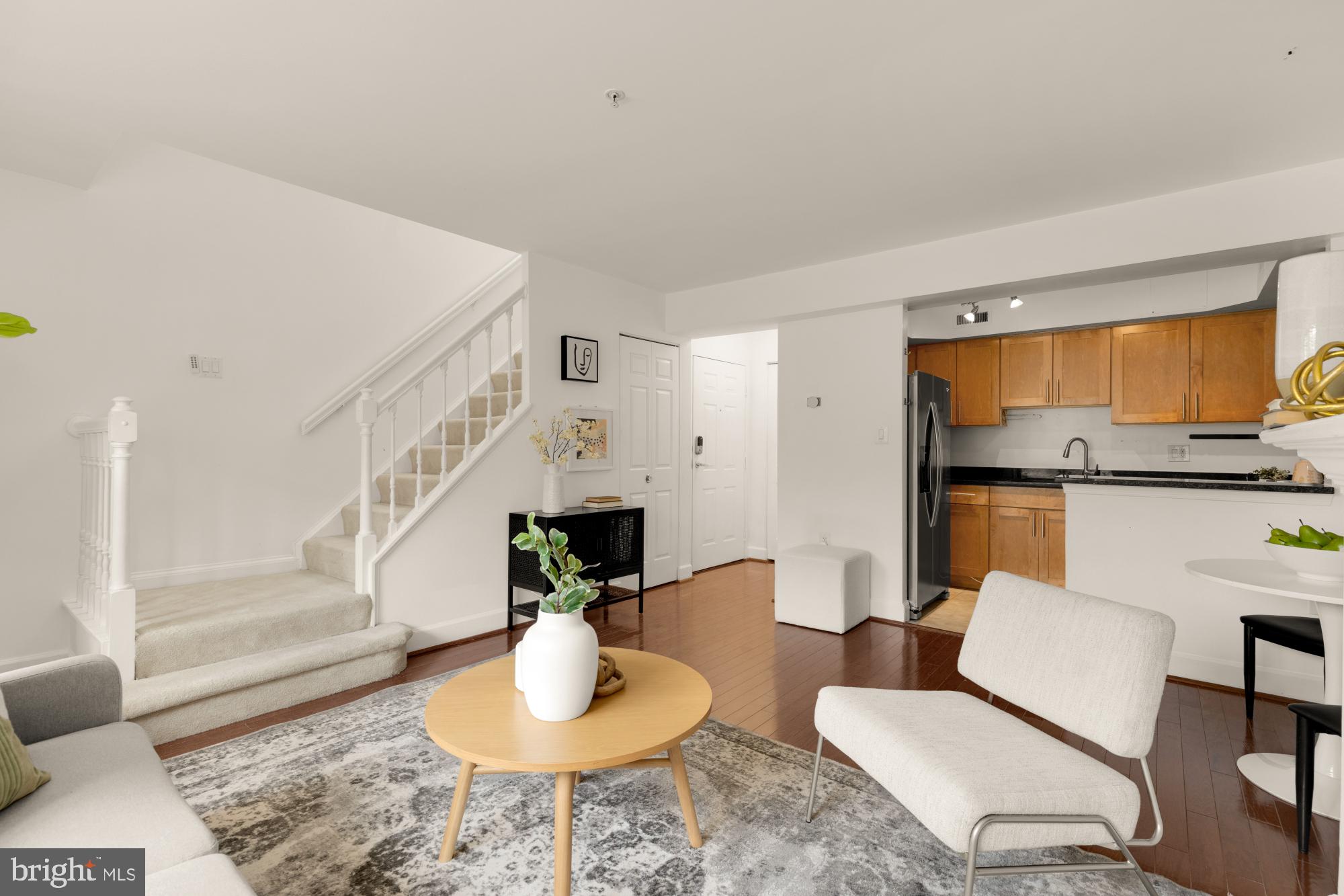 3601 38th Street Northwest, Unit 303 Washington, DC 20016 - Photo 3 of 19 a living room with furniture and a wooden floor