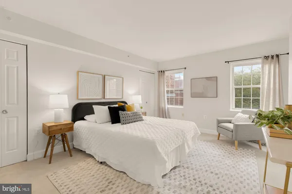 a bedroom with a bed and a couch
