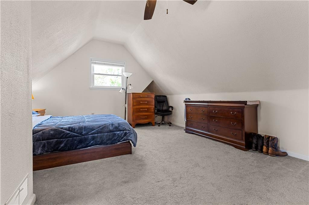 1415 Anderson Road Pittsburgh, PA 15209 - Photo 18 of 25 a bedroom with a bed and a television