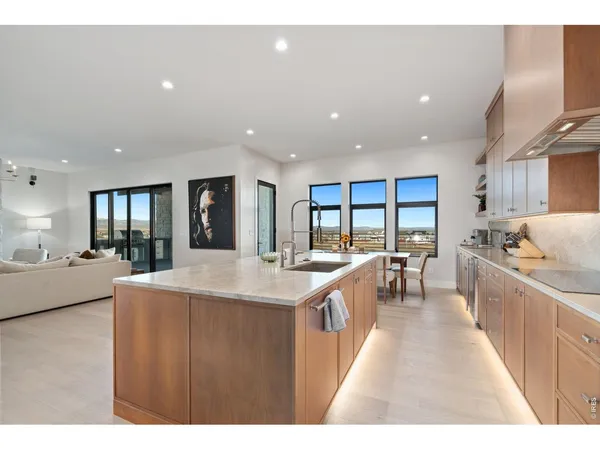 a large kitchen with stainless steel appliances a lot of counter space