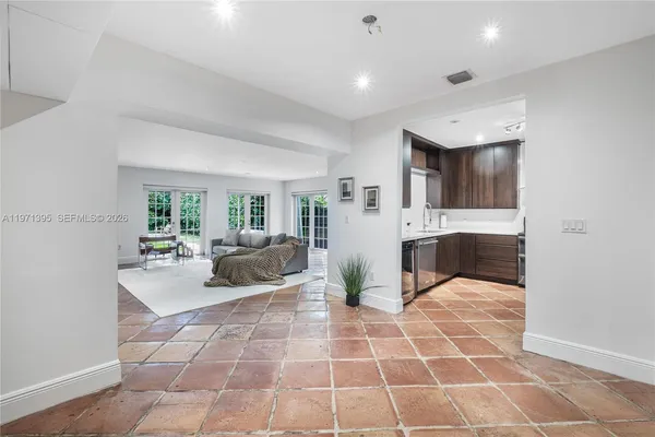 a lobby with a couch and a view of living room