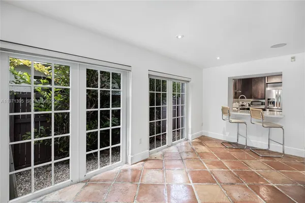 a view of a livingroom with furniture and a window