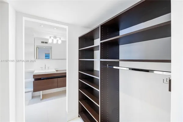 a room with a walk in closet and a window