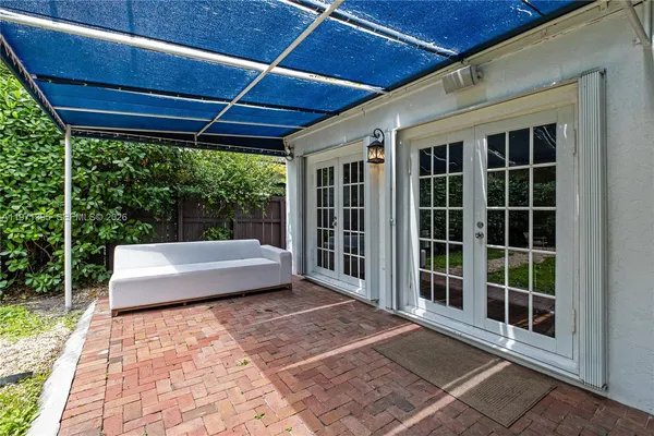 a view of a house with backyard porch and garden