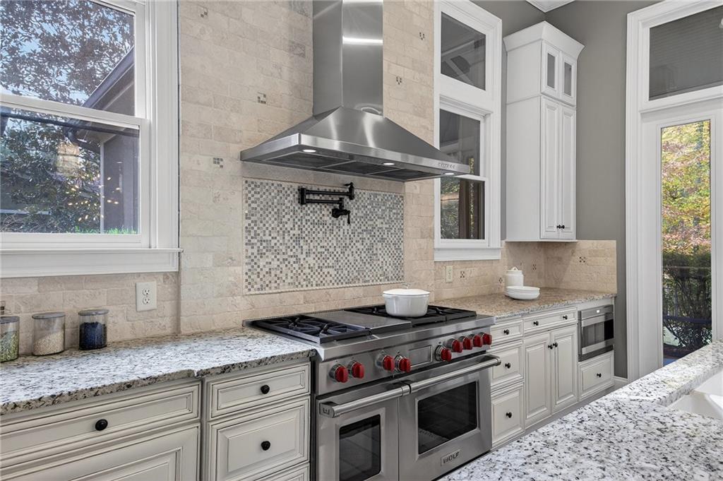 3640 Rivers Call Boulevard Atlanta, GA 30339 - Photo 13 of 63 a kitchen with granite countertop a stove oven and sink
