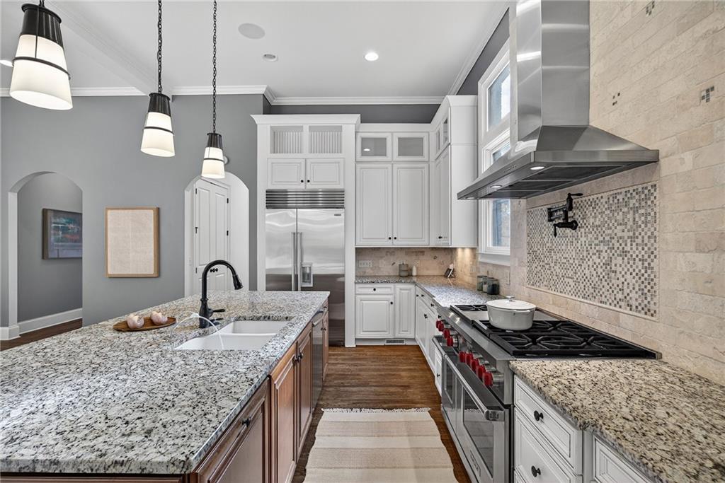 3640 Rivers Call Boulevard Atlanta, GA 30339 - Photo 14 of 63 a kitchen with stainless steel appliances granite countertop a sink stove and cabinets