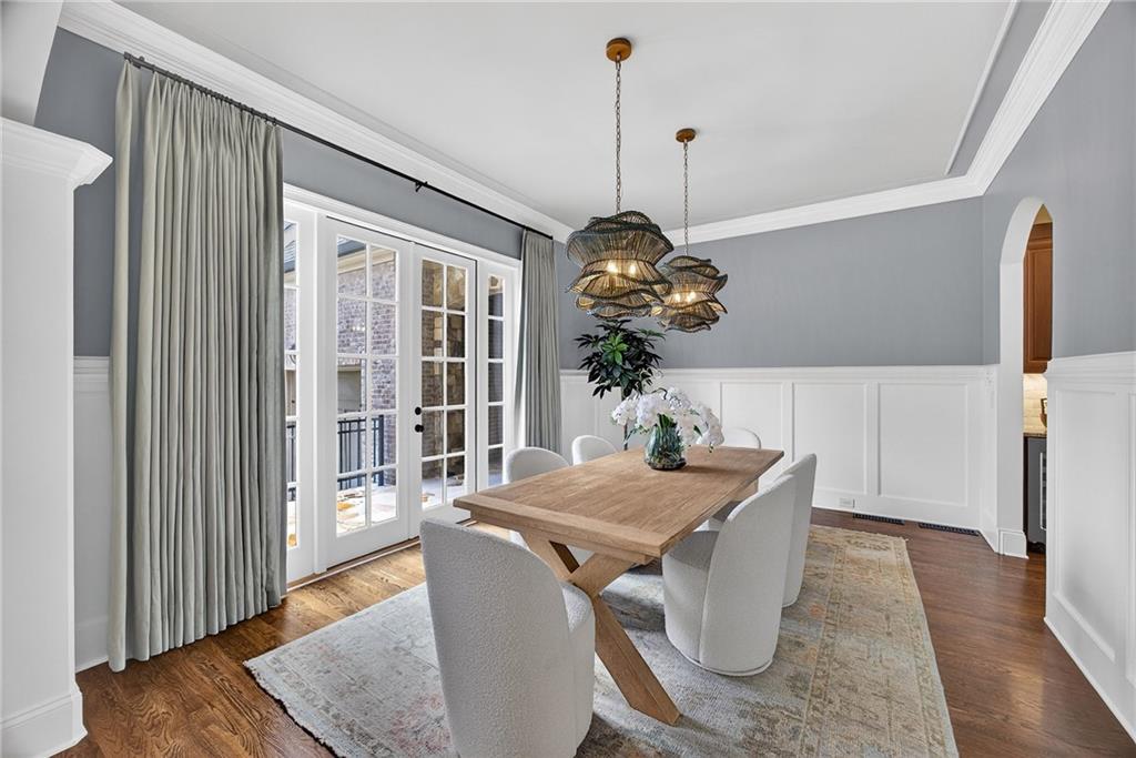 3640 Rivers Call Boulevard Atlanta, GA 30339 - Photo 24 of 63 a view of a dining room with furniture wooden floor and chandelier