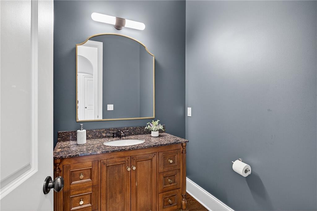 3640 Rivers Call Boulevard Atlanta, GA 30339 - Photo 29 of 63 a bathroom with a granite countertop sink and a mirror