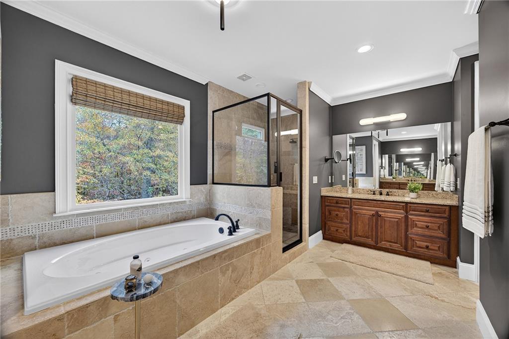 3640 Rivers Call Boulevard Atlanta, GA 30339 - Photo 36 of 63 a large spacious bathroom with a granite countertop tub sink and mirror