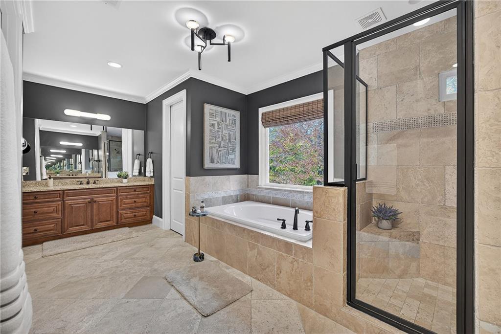 3640 Rivers Call Boulevard Atlanta, GA 30339 - Photo 37 of 63 a spacious bathroom with a tub sink shower and mirror