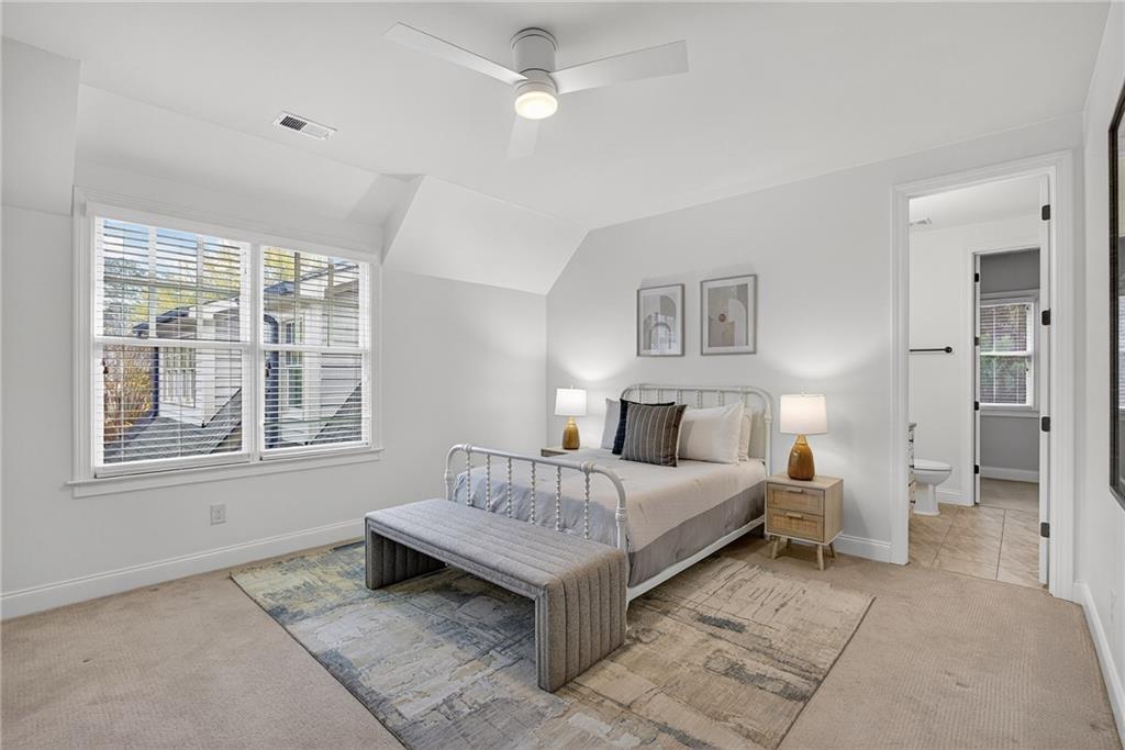 3640 Rivers Call Boulevard Atlanta, GA 30339 - Photo 38 of 63 a bedroom with a bed lamp and a window