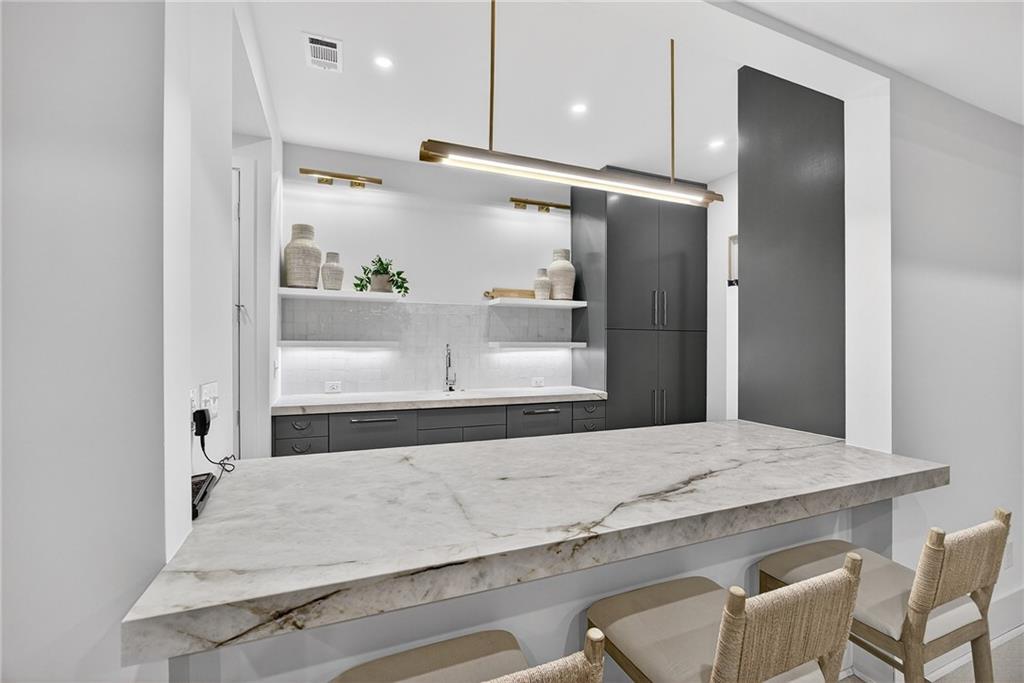 3640 Rivers Call Boulevard Atlanta, GA 30339 - Photo 50 of 63 a bathroom with a granite countertop sink and a mirror
