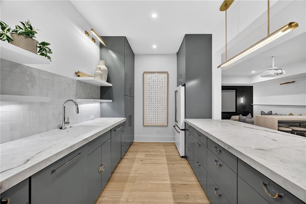 3640 Rivers Call Boulevard Atlanta, GA 30339 - Photo 51 of 63 a large kitchen with kitchen island a sink stainless steel appliances and cabinets