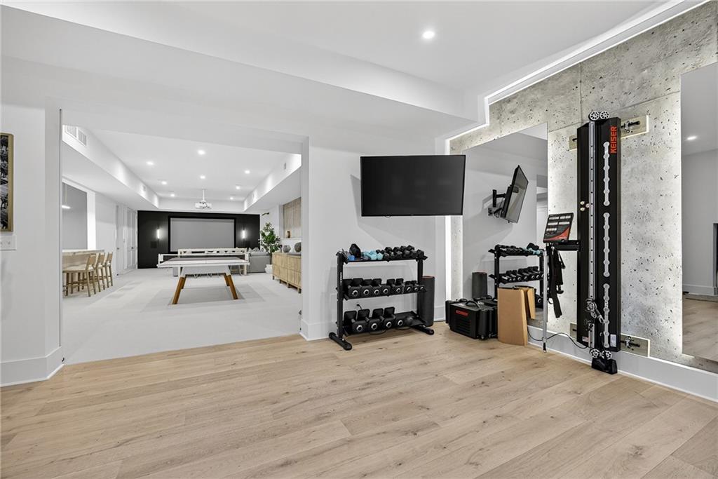 3640 Rivers Call Boulevard Atlanta, GA 30339 - Photo 57 of 63 a living room with furniture and a flat screen tv