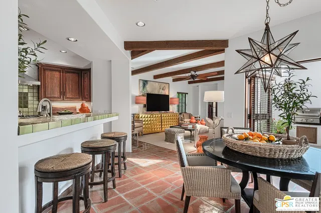 a kitchen with stainless steel appliances a stove a sink and a refrigerator