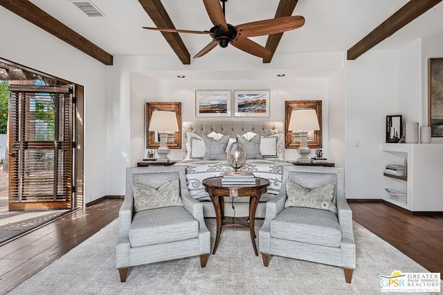 a large white kitchen with a large window