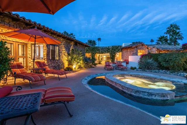 a view of a swimming pool with a lounge chairs