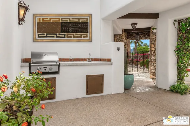 a view of a hall way with furniture